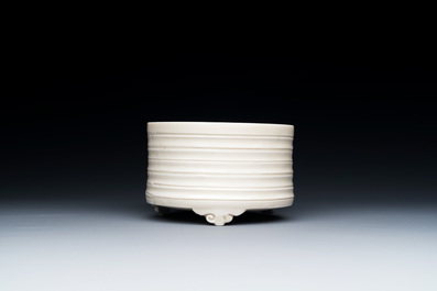 A Chinese Dehua blanc de Chine tripod censer, Kangxi