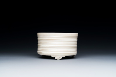 A Chinese Dehua blanc de Chine tripod censer, Kangxi