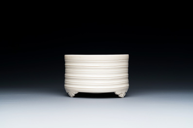 A Chinese Dehua blanc de Chine tripod censer, Kangxi