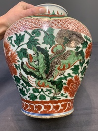 A Chinese wucai 'Buddhist lion and peony scroll' vase, Transitional period