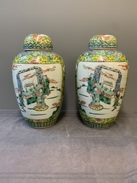 A pair of Chinese famille verte yellow-ground vases and covers with narrative design, 19th C.
