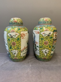 A pair of Chinese famille verte yellow-ground vases and covers with narrative design, 19th C.