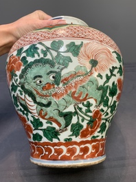 A Chinese wucai 'Buddhist lion and peony scroll' vase, Transitional period