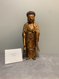 A fine Chinese gilt-lacquered wooden figure of the standing Buddha, Ming