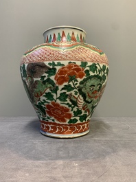 A Chinese wucai 'Buddhist lion and peony scroll' vase, Transitional period