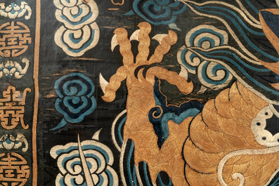 A Chinese embroidered silk tapestry with a five-clawed dragon among clouds and bajixiang, 18/19th C.