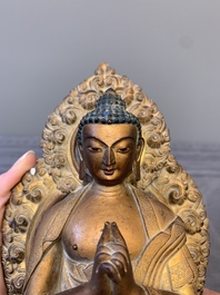 A fine Chinese gilt bronze Buddha, Qianlong mark and of the period