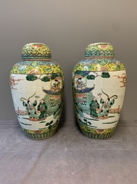 A pair of Chinese famille verte yellow-ground vases and covers with narrative design, 19th C.