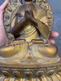 A fine Chinese gilt bronze Buddha, Qianlong mark and of the period