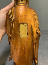 A fine Chinese gilt-lacquered wooden figure of the standing Buddha, Ming