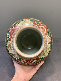 A Chinese wucai 'Buddhist lion and peony scroll' vase, Transitional period