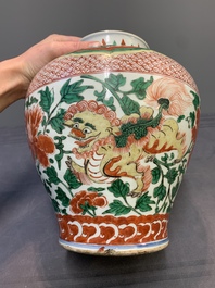 A Chinese wucai 'Buddhist lion and peony scroll' vase, Transitional period