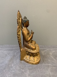 A fine Chinese gilt bronze Buddha, Qianlong mark and of the period