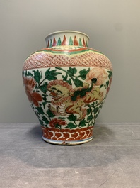 A Chinese wucai 'Buddhist lion and peony scroll' vase, Transitional period