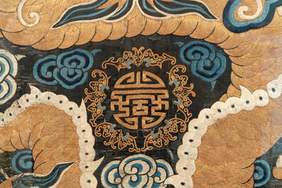 A Chinese embroidered silk tapestry with a five-clawed dragon among clouds and bajixiang, 18/19th C.