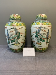 A pair of Chinese famille verte yellow-ground vases and covers with narrative design, 19th C.