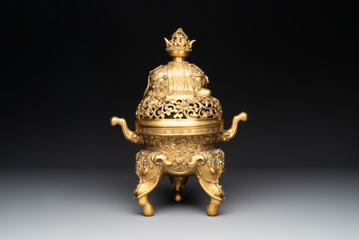 A large Chinese precious stone-inlaid gilt bronze 'elephant' tripod censer and cover on wooden stand, 19th C.