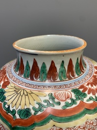 A Chinese wucai 'Buddhist lion and peony scroll' vase, Transitional period