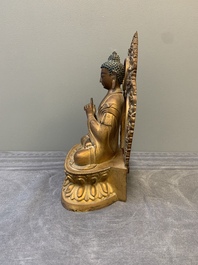 A fine Chinese gilt bronze Buddha, Qianlong mark and of the period