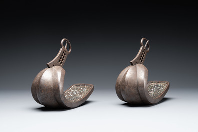 A pair of Japanese steel 'abumi' stirrups with silver and mother-of-pearl-inlay, Edo, 18/19th C.