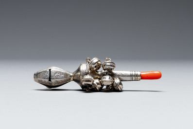 Two silver bottle stoppers, a tobacco box and a baby rattle with red coral teether, Germany, 19/20th C.