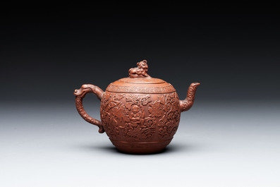 A Chinese Yixing stoneware teapot with boys among flower scrolls, Kangxi