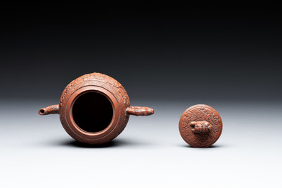 A Chinese Yixing stoneware teapot with boys among flower scrolls, Kangxi