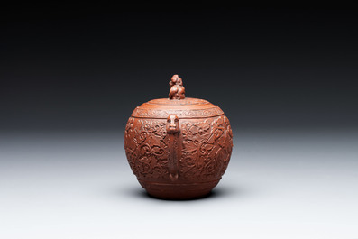 A Chinese Yixing stoneware teapot with boys among flower scrolls, Kangxi