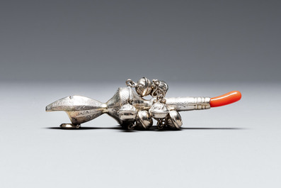 Two silver bottle stoppers, a tobacco box and a baby rattle with red coral teether, Germany, 19/20th C.