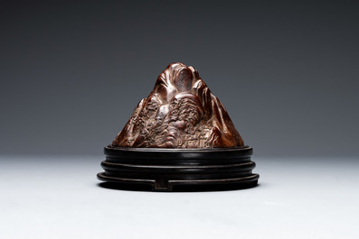 A Chinese agarwood carving of a mountain on wooden stand, 18/19th C.