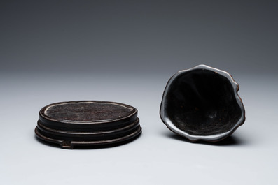 A Chinese agarwood carving of a mountain on wooden stand, 18/19th C.