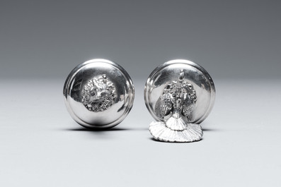 Two silver bottle stoppers, a tobacco box and a baby rattle with red coral teether, Germany, 19/20th C.