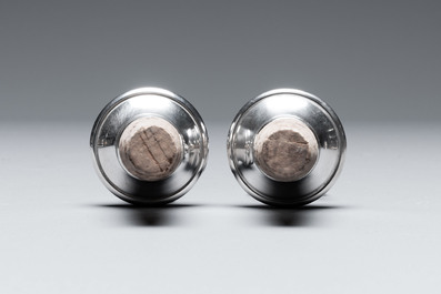Two silver bottle stoppers, a tobacco box and a baby rattle with red coral teether, Germany, 19/20th C.