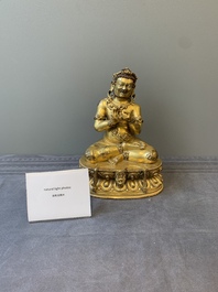 A Sino-Tibetan gilt bronze Virūpa, 19th C.