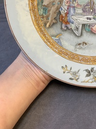 A fine pair of Chinese Canton famille rose 'ladies in the garden' plates, Yongzheng/Qianlong