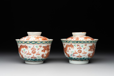 Two famille rose 'dragon' bowls and covers and a plate, Qianlong and Guangxu marks, 19/20th C.