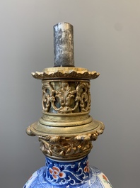 A pair of Chinese famille verte vases mounted as lamps, Kangxi