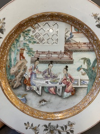 A fine pair of Chinese Canton famille rose 'ladies in the garden' plates, Yongzheng/Qianlong
