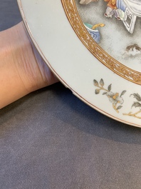 A fine pair of Chinese Canton famille rose 'ladies in the garden' plates, Yongzheng/Qianlong