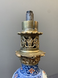 A pair of Chinese famille verte vases mounted as lamps, Kangxi