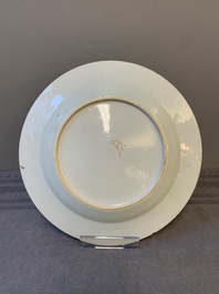 A fine pair of Chinese Canton famille rose 'ladies in the garden' plates, Yongzheng/Qianlong