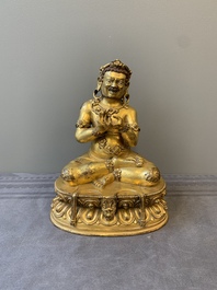 A Sino-Tibetan gilt bronze Virūpa, 19th C.