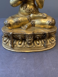 A Sino-Tibetan gilt bronze Virūpa, 19th C.