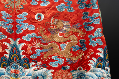 A fine Chinese gold thread embroidered red-ground silk noble lady&rsquo;s 'dragon' robe, 18/19th C.