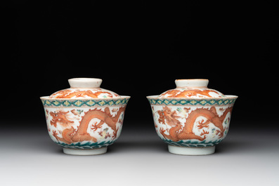 Two famille rose 'dragon' bowls and covers and a plate, Qianlong and Guangxu marks, 19/20th C.