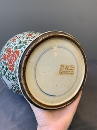 A Chinese wucai 'boy and peony scroll' vase and cover, 17th C.