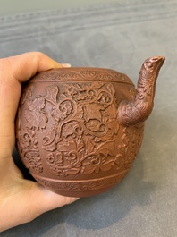 A Chinese Yixing stoneware teapot with boys among flower scrolls, Kangxi