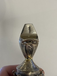 Two silver bottle stoppers, a tobacco box and a baby rattle with red coral teether, Germany, 19/20th C.