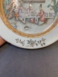 A fine pair of Chinese Canton famille rose 'ladies in the garden' plates, Yongzheng/Qianlong