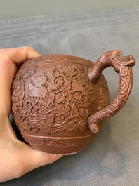 A Chinese Yixing stoneware teapot with boys among flower scrolls, Kangxi
